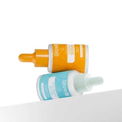 Glowx Two skincare serum bottles with orange and blue labels on a white background